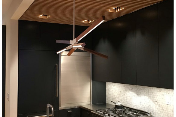 Modern kitchen with dark cabinets and wood slat ceiling